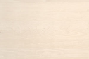 Superficie di legno chiaro con venature visibili.